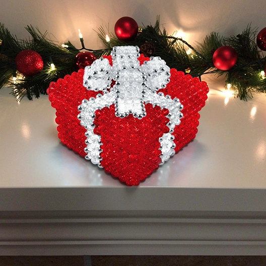 Red Beaded Box with Crystal Bow over the Fireplace