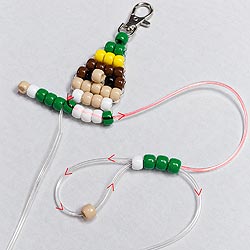 Free beaded elf buddy ornament pattern showing how the cords separate and weave through the pony beads to form the elf's arms.