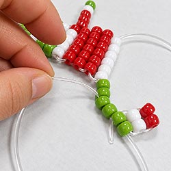 Free pony bead keychain instructions showing the cord and bead placement for making the grinch legs.