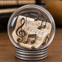 Music-themed fillable ornament featuring sheet music and musical notes for musicians, band students, and music room décor.