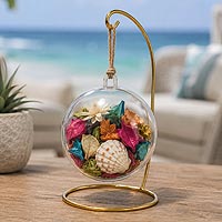 Beach-inspired fillable ornament potpourri craft idea featuring seashells, dried flowers, and home décor accents for year-round decorating.